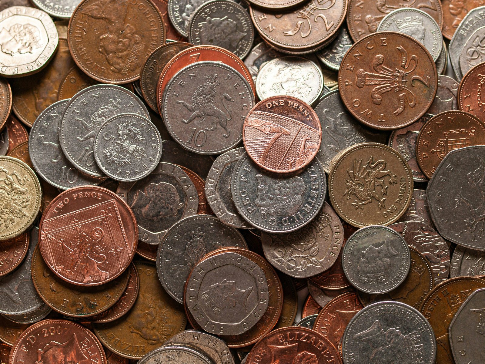 The article argues current money systems hinder sustainability